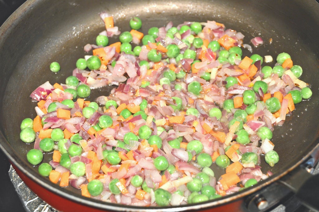 Add Carrot and Green Peas.
