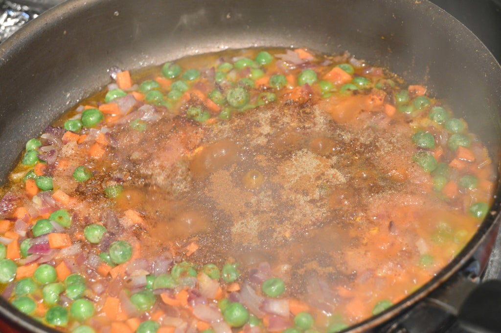 Adding Tomato Puree and Spices